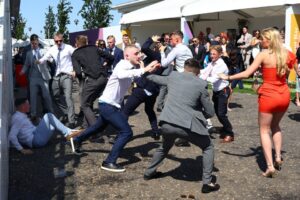 Epsom Derby: Huge fight breaks out at racecourse with boozed-up revellers throwing punches in shocking scenes