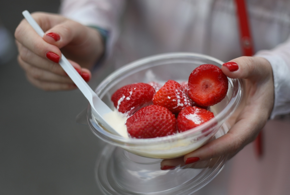 Why do they sell strawberries and cream at Wimbledon and how much does it cost?