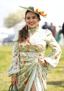 Glam racegoers pull out all the style stops as they arrive for Derby Day at Epsom Downs racecourse