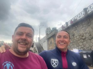 West Ham fan jogs alongside Mark Noble with can of beer as he plays ‘Celebrity Bingo’ ahead of Conference League final