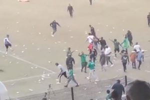 Crowd runs for cover after fans fire gunshots in heated play-off that sees goalkeeper coach attacked in pitch invasion