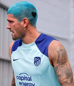 World Cup winner looks unrecognisable with bizarre new haircut as he’s compared to flamboyant team-mate