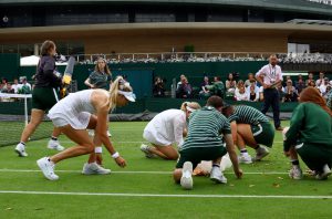 Brit tennis star Katie Boulter praised for clearing up mess after Wimbledon’s SECOND court invasion