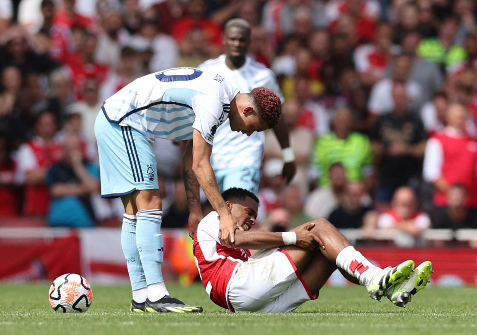 Arsenal fans fear worst as Jurrien Timber hobbles off injured after TWO nasty knocks on Premier League debut