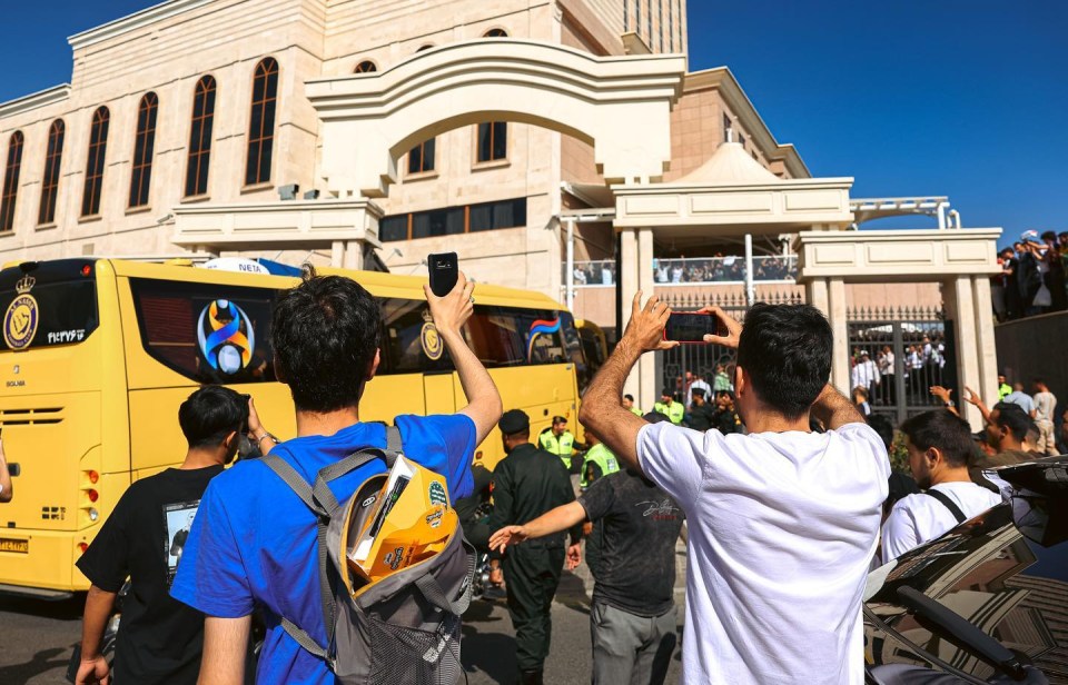 Cristiano Ronaldo fans swarm Al-Nassr squad and chase team bus to get glimpse of superstar as he touches down in Iran