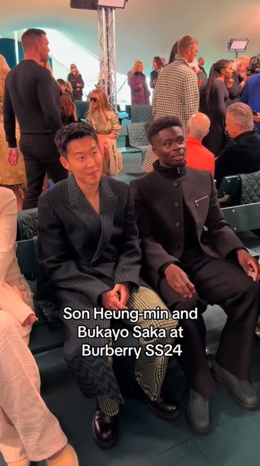 Saka and Son look awkward as they sit together at fashion show just days before North London derby with fans horrified