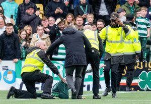 Celtic manager Brendan Rodgers rushes on pitch and SHOVES steward to ‘rescue’ young fan