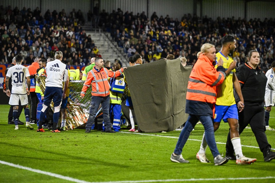 Ajax vs RKC Waalwijk suspended and players leave pitch in tears after keeper collapses on pitch after horror collision