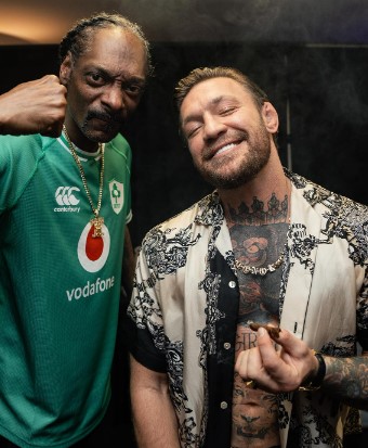 Snoop Dogg touches Dee Devlin’s baby bump as he parties with UFC star Conor McGregor after Dublin concert