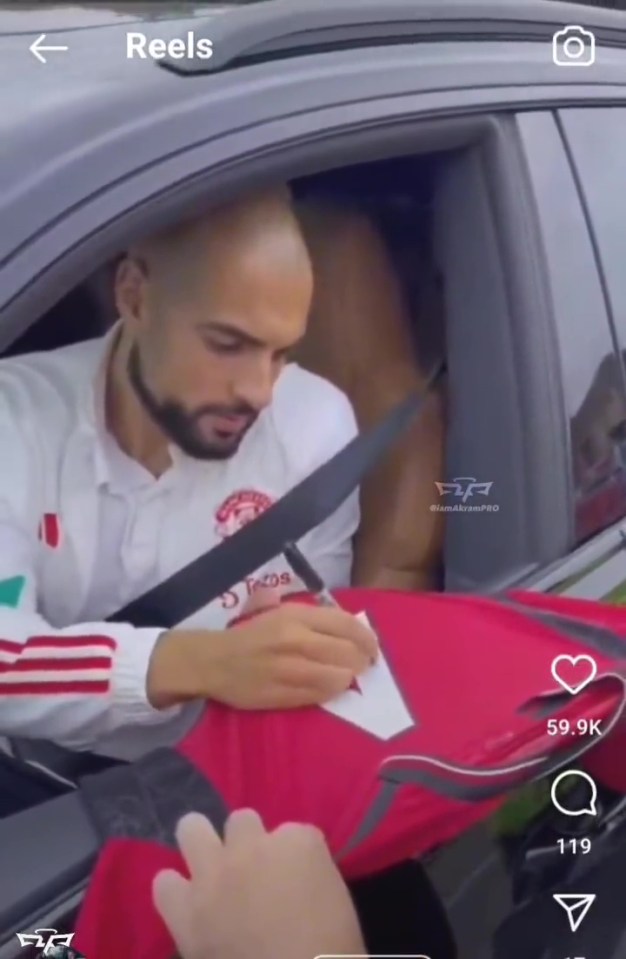 Sofyan Amrabat looks shocked after receiving gift from young Man Utd fan in ‘beautiful’ moment