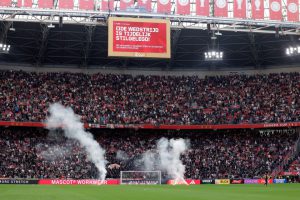 Ajax vs Feyenoord ABANDONED after 55 minutes as flares thrown on pitch before hooligans break into stadium