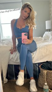 Paige Spiranac fans ‘struggle to focus’ as she stuns in busty outfit at Homestead Miami Speedway before covering up