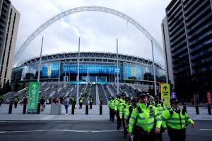 Police increase presence at Wembley for England’s Euro 2024 qualifier tonight after two fans killed in Brussels horror