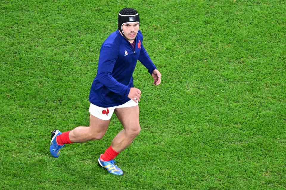 Why is France captain Antoine DuPont wearing a scrum cap?