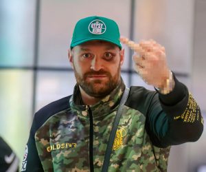 Fuming Tyson Fury sticks middle finger up as he arrives back in UK with huge back eye after pummelling from Ngannou