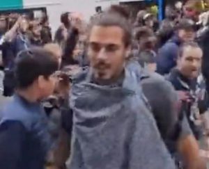 Shocking moment PSG fan punches member of public as they march through city before Champions League clash