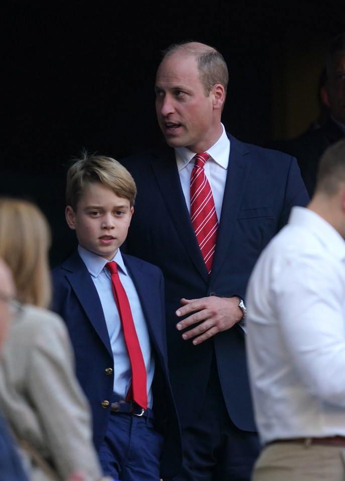 Prince William and George grin from the stands as they enjoy the Rugby World Cup quarter final match in France