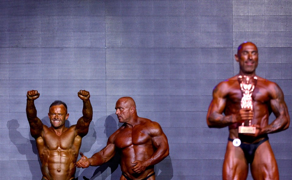 Inside bodybuilding Night of Champions as veteran competitors smoke, flex and top up spray tans in incredible pictures