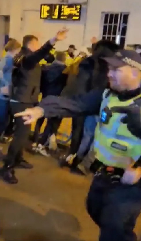 Brighton fans clash with Ajax supporters as cops brandish batons in violent scenes after Europa League match