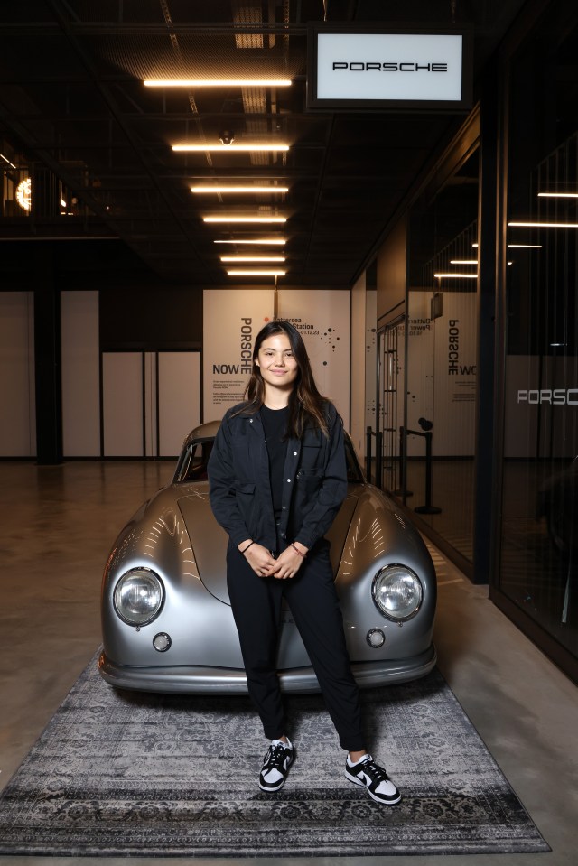 Emma Raducanu poses with vintage Porsche at glamorous event hours after hinting at stunning career change