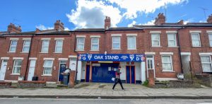 We live INSIDE Luton Town’s famous entrance – footballs smash our windows but there are some surprising perks