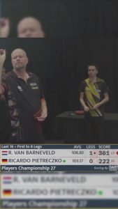 Raymond van Barneveld looks baffled as Gary Anderson accidentally interrupts his darts match