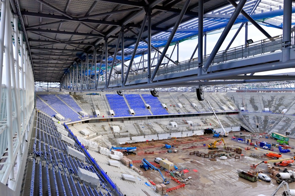 Premier League stadium looks incredible as new pictures show cranes on pitch and first seats installed