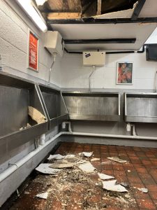 Toilet roof at Premier League stadium collapses leaving gaping hole and smashed plaster all over floor