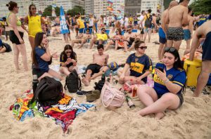 Shocking moment gigantic brawl breaks out on world’s most famous beach after fan ‘ambush’ before Copa Libertadores final