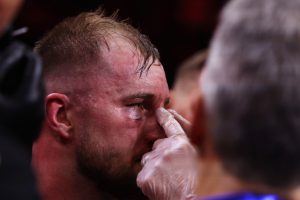 Medics tend to battered Otto Wallin as Swede suffers suspected broken nose after brutal Anthony Joshua loss