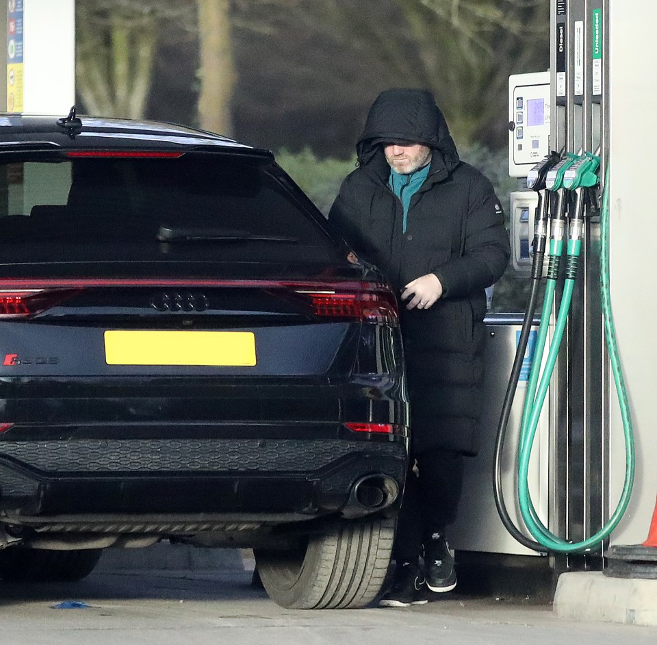 Wayne Rooney seen for first time since being sacked by Birmingham as glum England legend fills up £120k Audi with petrol