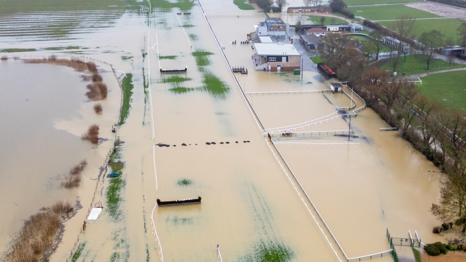 Stunning British racecourse becomes a total write-off as dirty water floods helpless track amid Storm Henk deluge