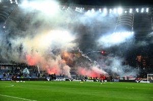 Lazio and Roma fans launch flares and fireworks at each other in shocking scenes before Rome derby