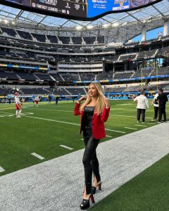 Gracie Hunt braves winter chill in plunging crop top on icy balcony as NFL fans gasp ‘your beauty melts the snow’