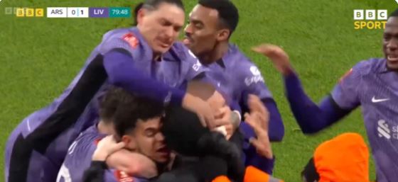 Hilarious moment Liverpool duo smack pitch invader on head after Arsenal goal and throw his hat into crowd