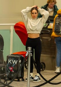 Lauryn Goodman flees UK with her two kids fathered by Kyle Walker – carrying KW branded bags as they head on holiday