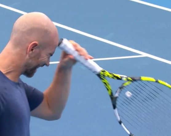 Tennis star left bleeding from his FACE after hitting himself with racket… but legend slams suspicious injury