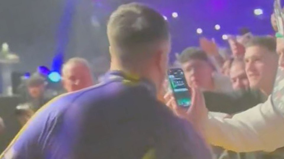 Luke Littler opens supporter’s FIFA pack during his Premier League Darts walkout as fans say ‘this lad is brilliant’