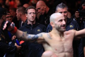 Mark Zuckerberg in awkward Volkanovski embrace after making shock UFC appearance but fans say Facebook CEO is ‘CURSED’