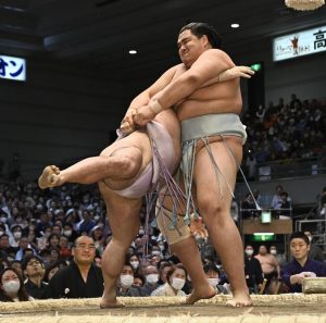 Top Sumo wrestler retires for bullying his trainees by slapping their testicles and shooting a FLAME-THROWER at them