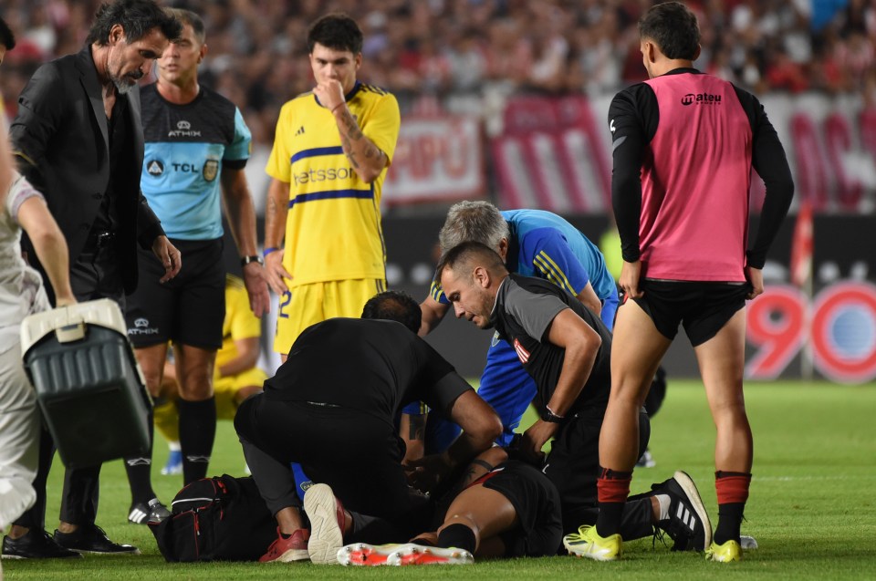 Terrifying moment footballer suffers seizure during match and is rushed to hospital as pregnant wife watches in horror