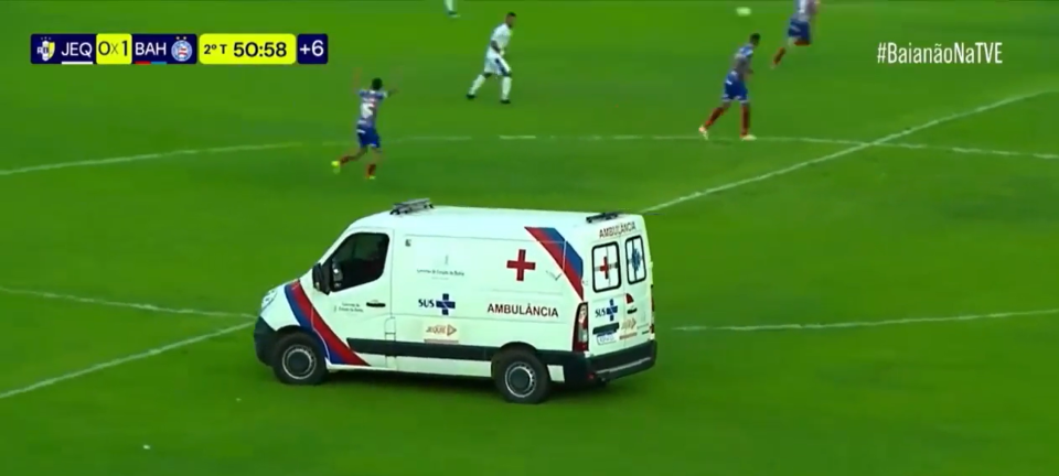 Moment ambulance whizzes on to football pitch despite match still being played as fans say ‘can’t make this stuff up’