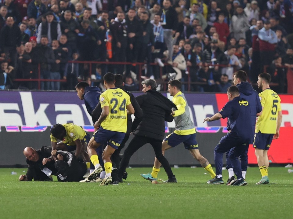 Fenerbahce threaten to QUIT league after shocking crowd chaos following clash saw Chelsea flop try to spinning kick fan