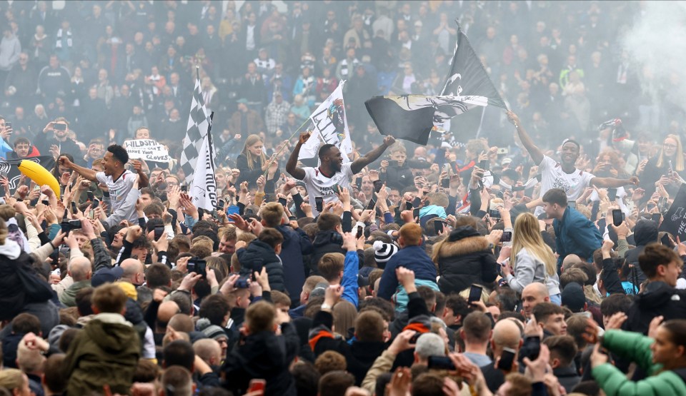 Thousands of ecstatic Derby fans invade pitch after sealing promotion back to Championship after two-year absence