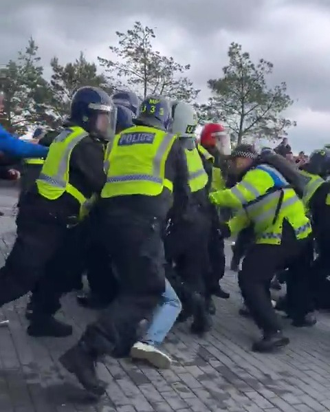 Police in riot gear clash with fans outside Tottenham Hotspur Stadium after Arsenal’s 3-2 win over fierce rivals