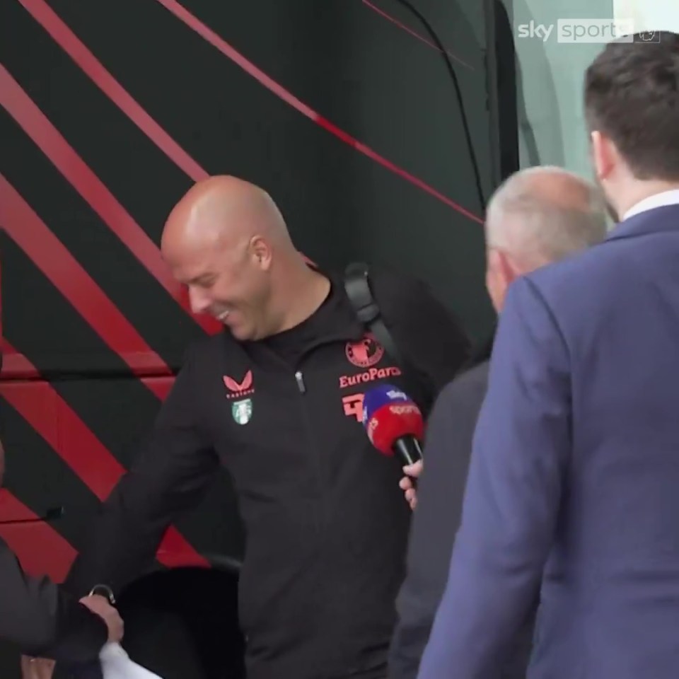 Awkward moment Sky Sports reporter grabbed by security as he asks Liverpool target Arne Slot question live on air