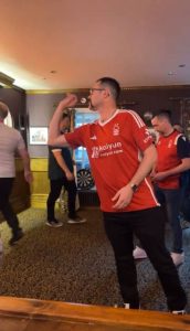 Darts World Cup winner stuns fans by rocking up to local pub to school amateurs in Nottingham Forest kit