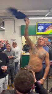 British boxing champion shouts at Norwich fans, rips shirt off and swings it around his head at rowdy Old Farm derby