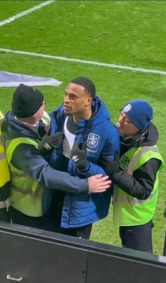 Furious EFL star has to be held back from his OWN FANS by stewards as he demands ‘respect’ in angry post-match clash