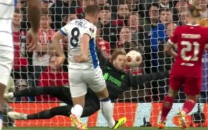 Watch Liverpool keeper Kelleher winces in pain after saving shot with his FACE in Europa League clash vs Atalanta